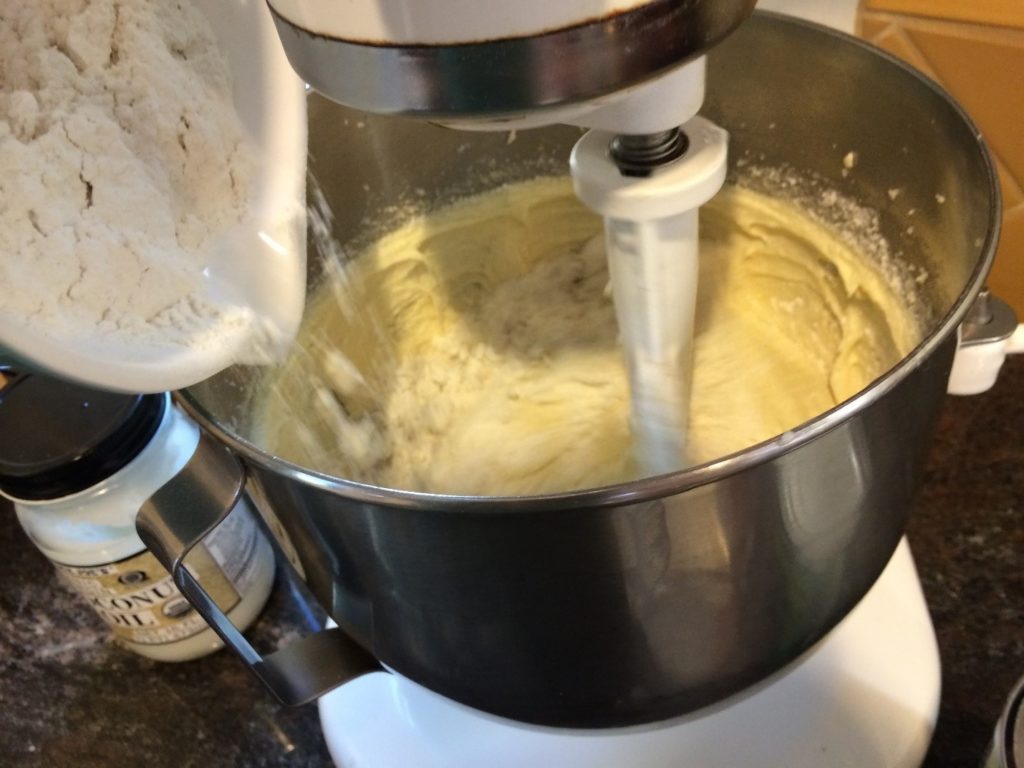 Adding gluten-free flour to mix (photo by Yvonne Condes)